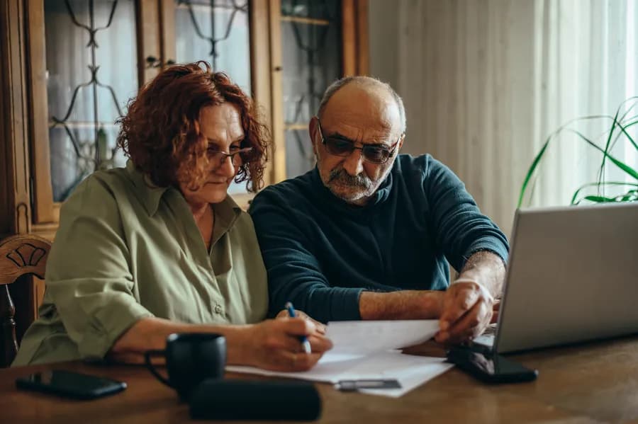 Homeowners reviewing their energy bills
