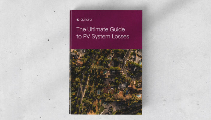 Book cover: 'Ultimate Guide to PV System Losses' with a residential aerial view."