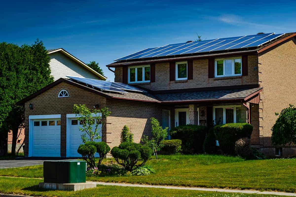 House with solar panels. Interaction with neighbors or other peers with solar can help solar prospects decide.