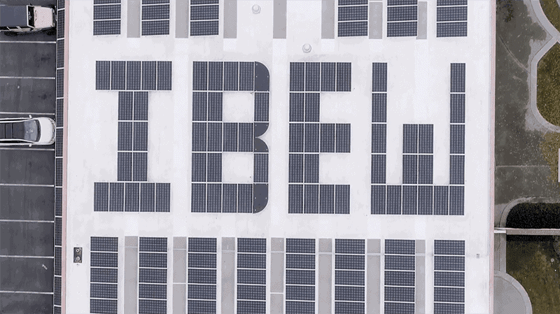 Close-up view of IBEW spelled out in solar panels on the roof of Local Union 332 in San Jose