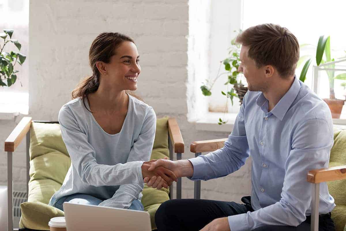 customer and salesman shaking hands